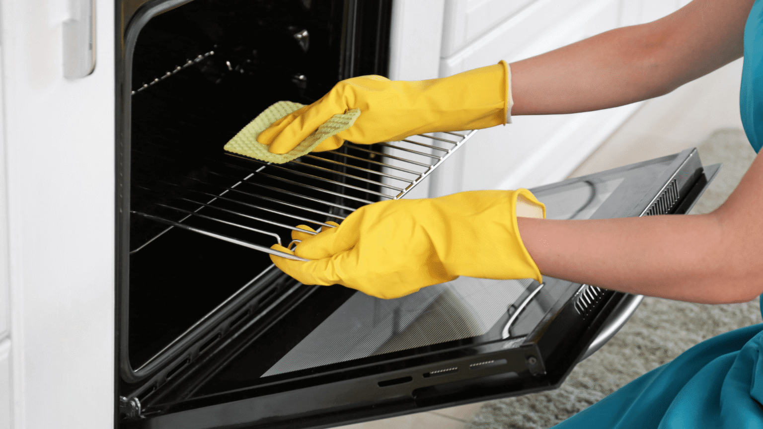 Professional oven cleaning, removing grease and dirt from racks with gloves and cleaning tools.